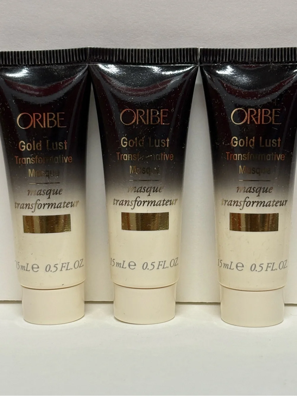 Oribe Gold Lust Transformative Masque - Black and Cream Tubes